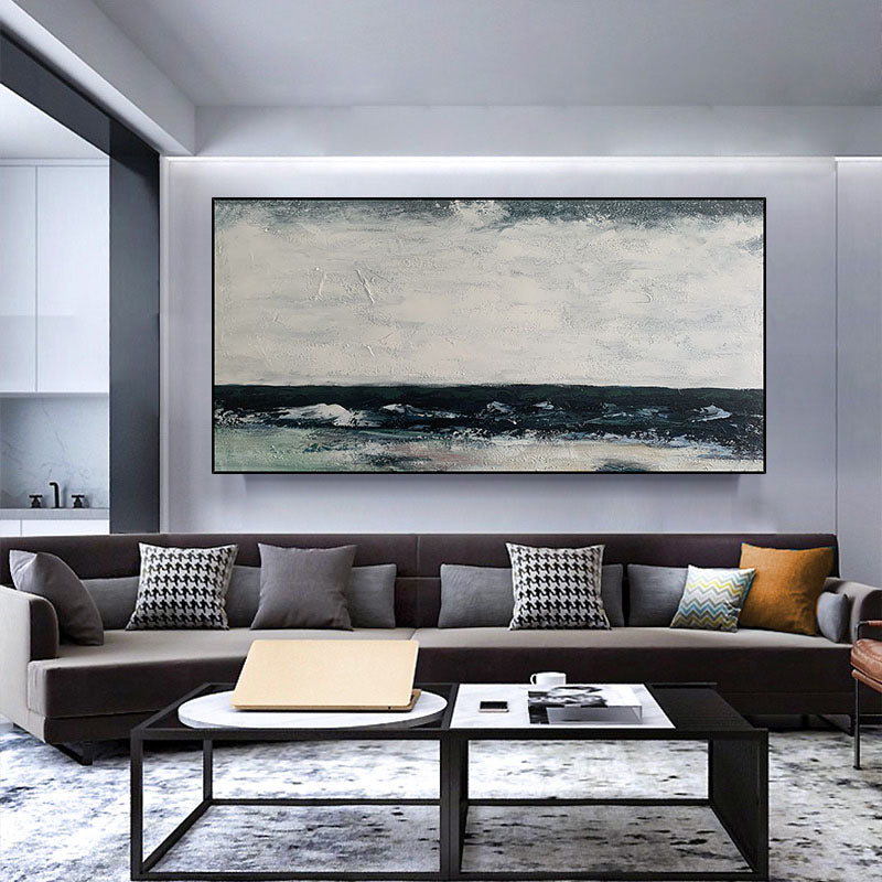 a living room filled with furniture and a painting on the wall