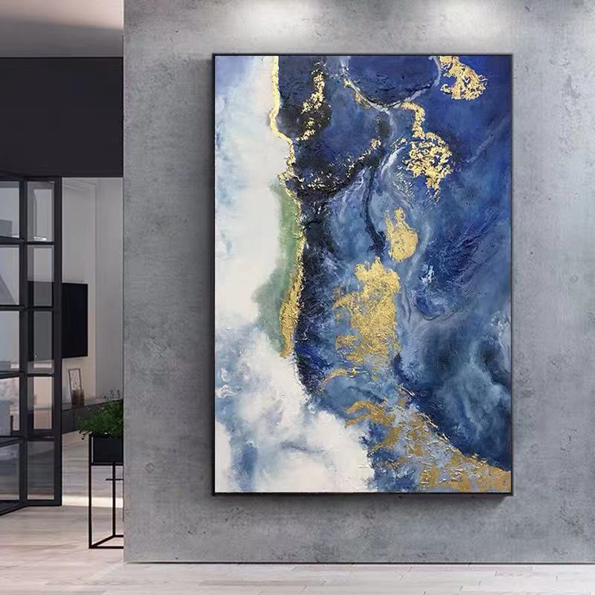 a painting hanging on a wall in a room