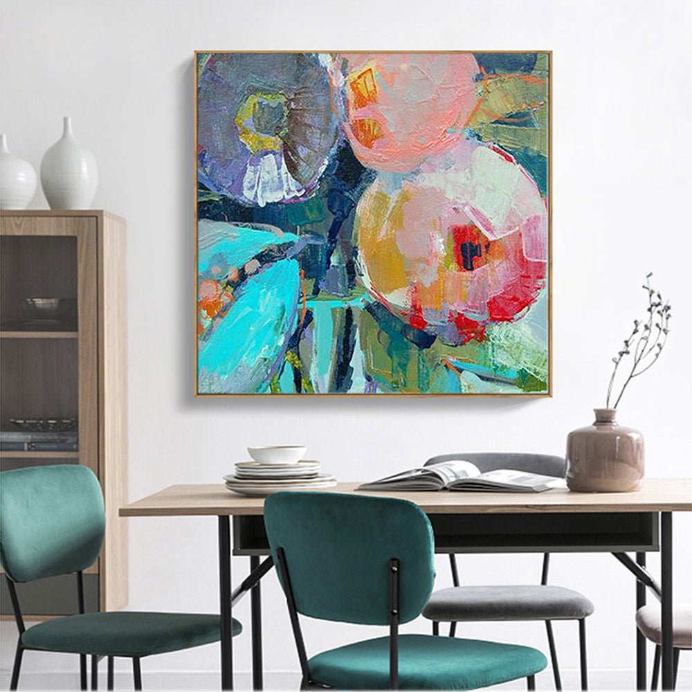 a painting on a wall above a dining room table