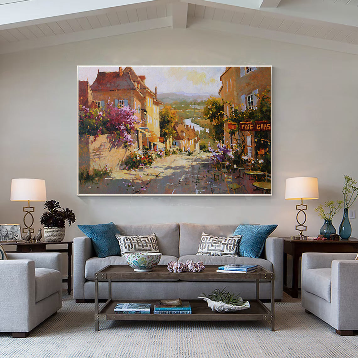 a living room filled with furniture and a painting on the wall