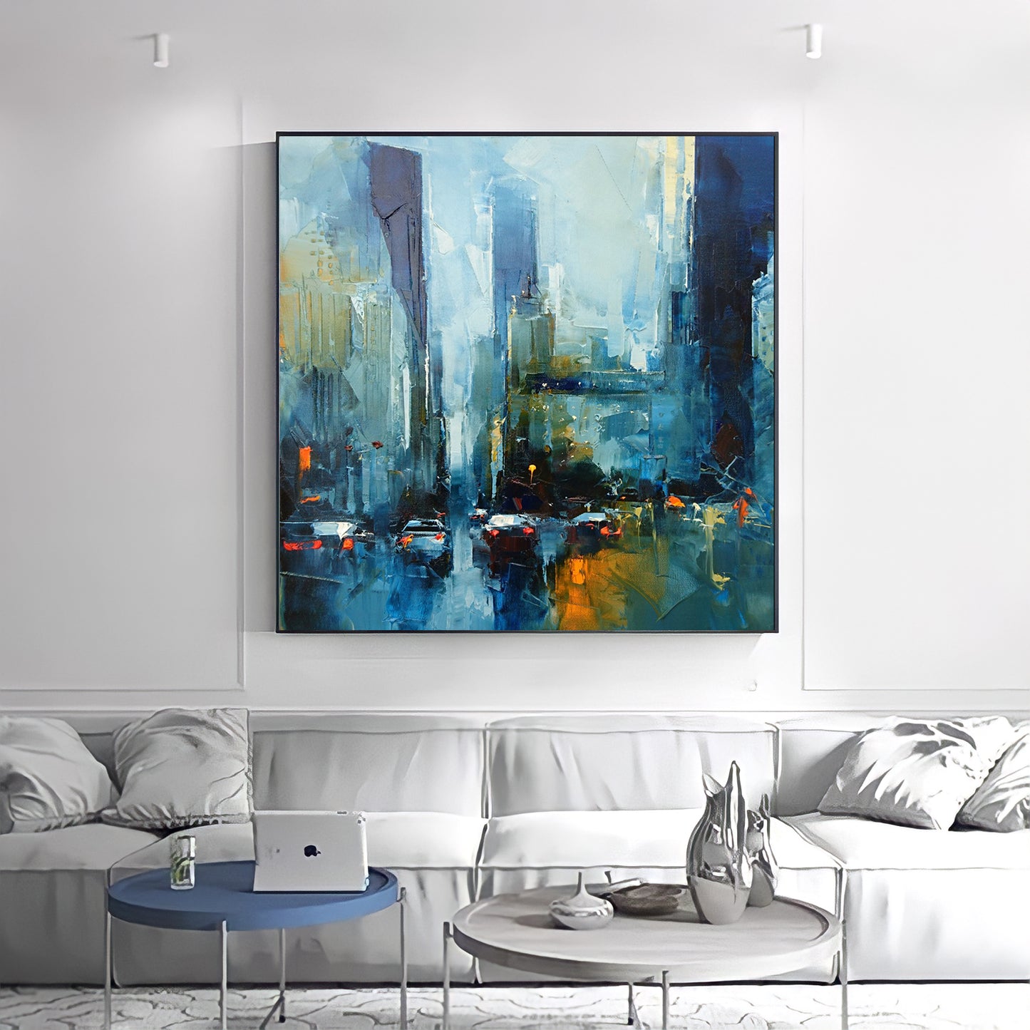 a living room with a couch and a painting on the wall