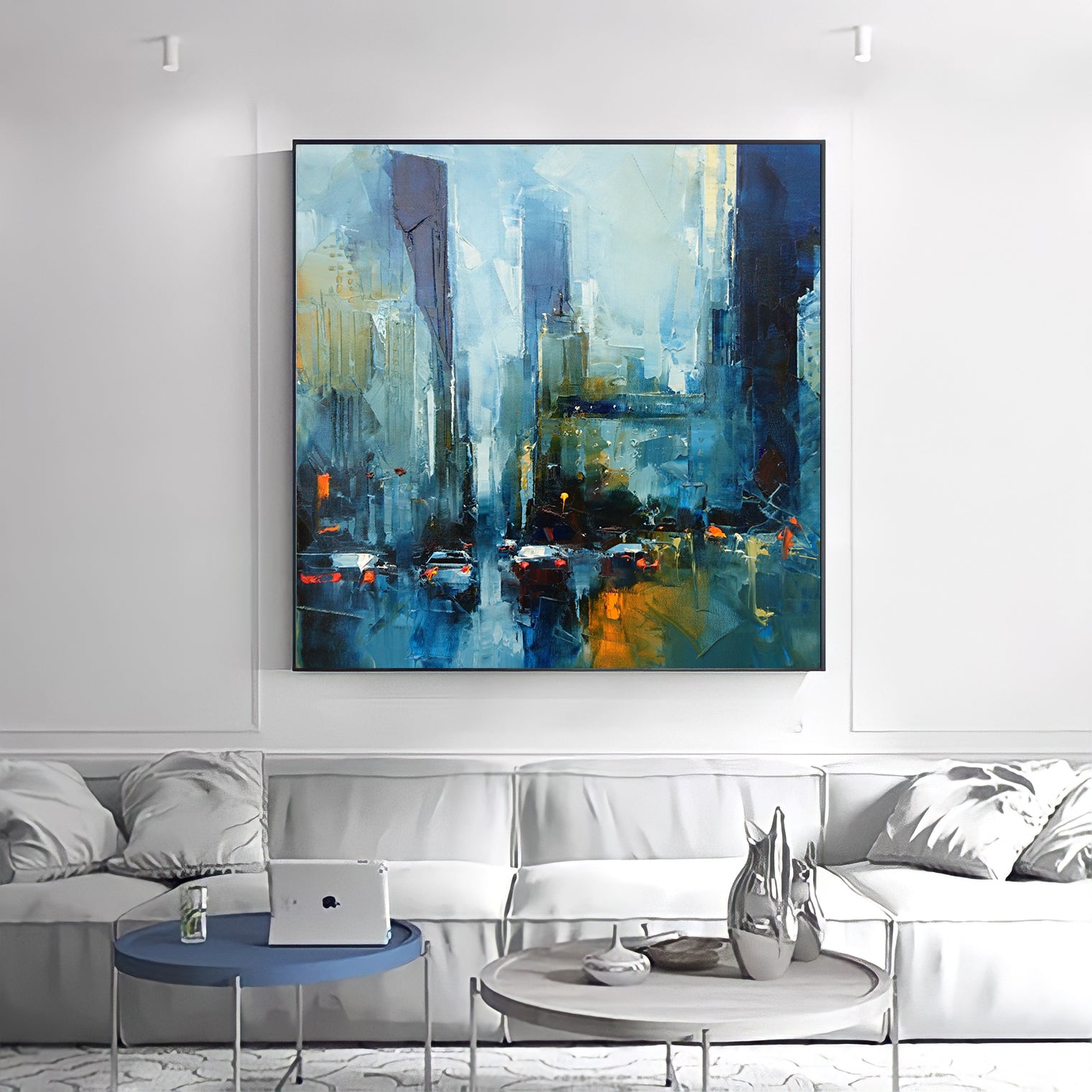 a living room with a couch and a painting on the wall