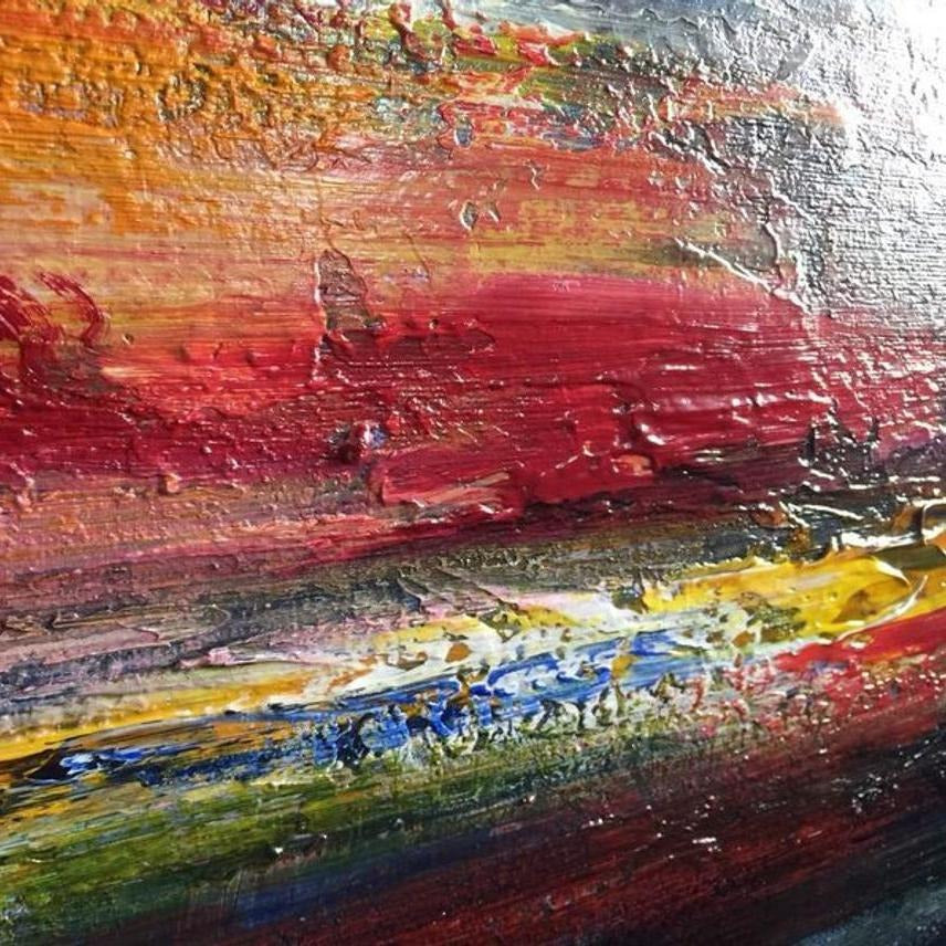 The image is a vibrant, abstract painting with bold, colorful brushstrokes and a mix of red, orange, yellow, green, blue, and purple hues. The painting appears to be a dynamic and energetic representation of a landscape or natural scene, with the colors and brushstrokes creating a sense of movement and energy.