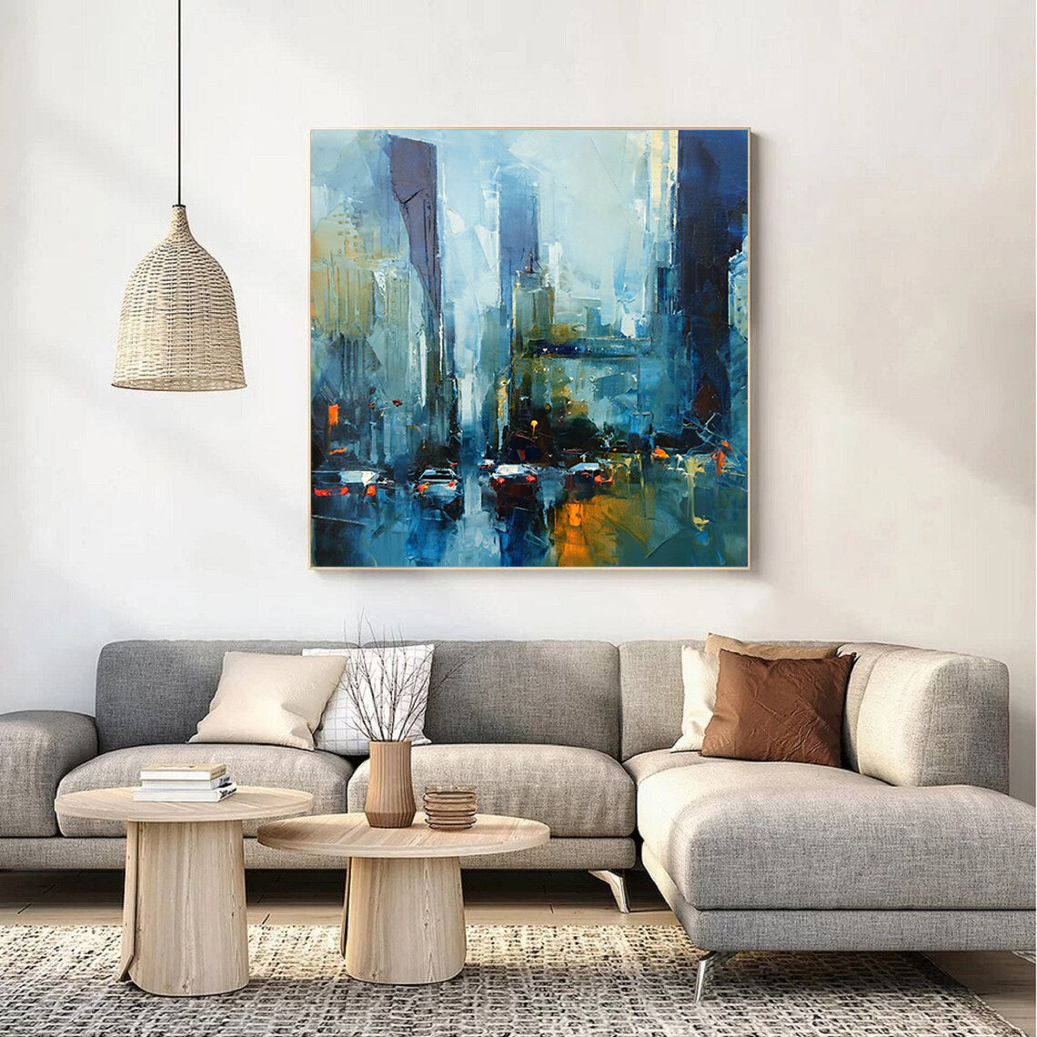 a living room with a couch and a painting on the wall