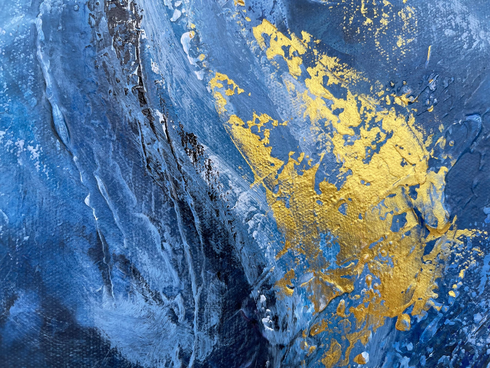 a close up of a blue and yellow painting