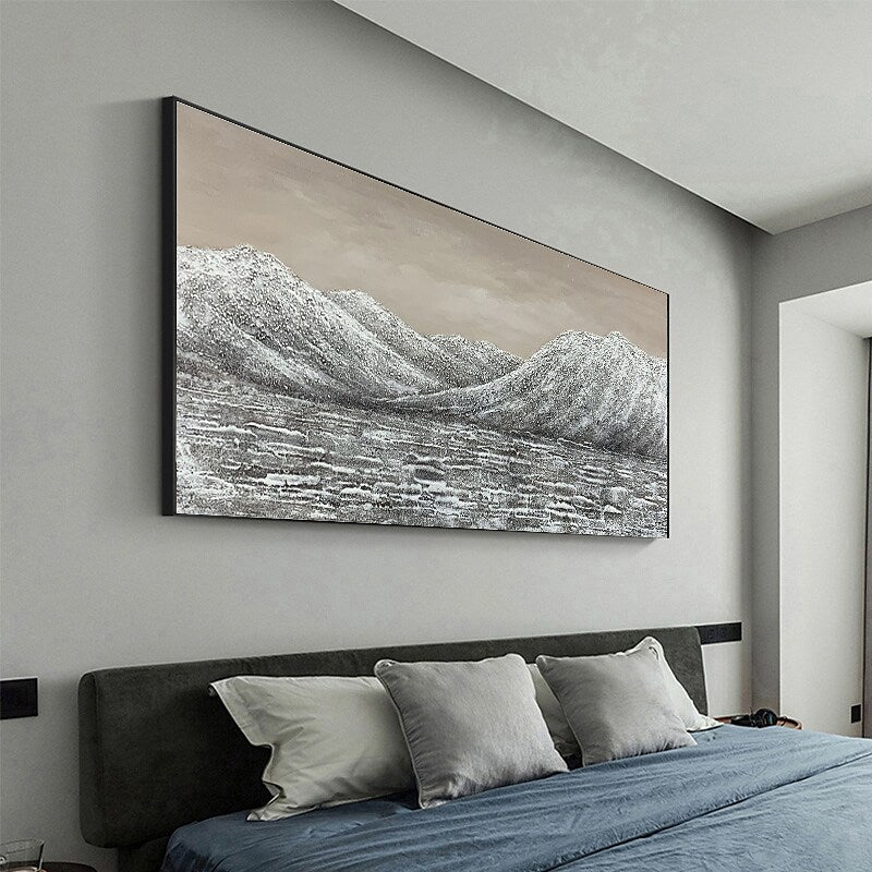 a bedroom with a large painting hanging above the bed