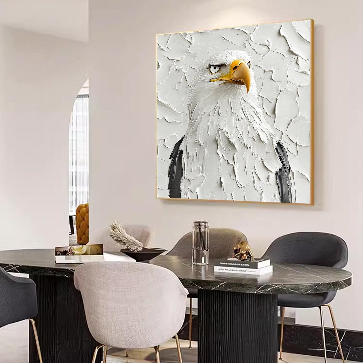 a painting of a bald eagle on a wall above a dining room table