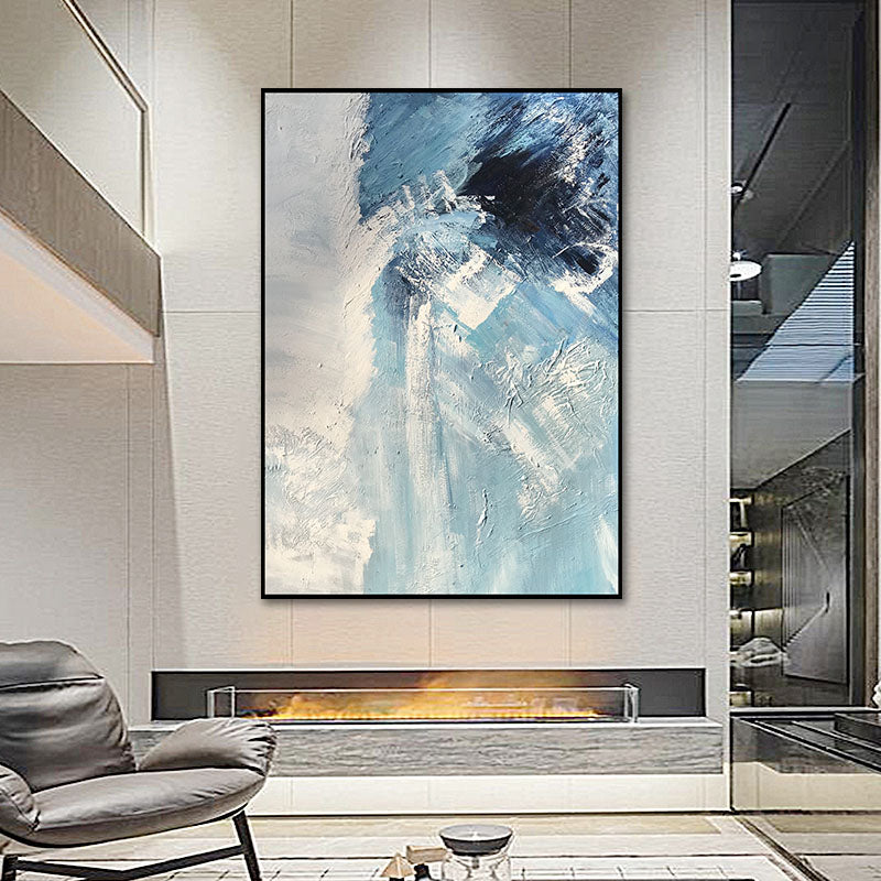 a living room with a large painting on the wall