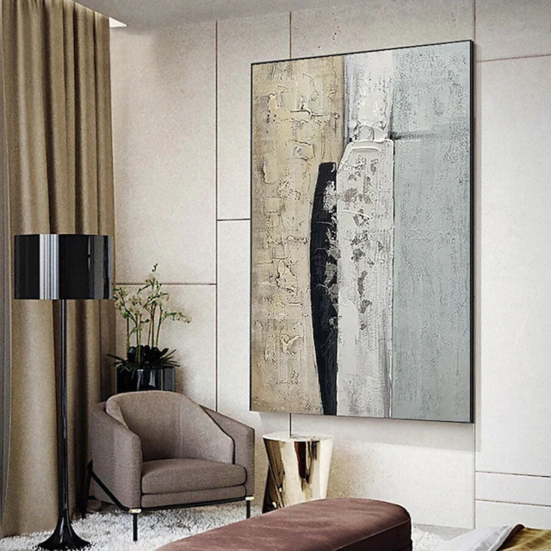 a living room with a large painting on the wall