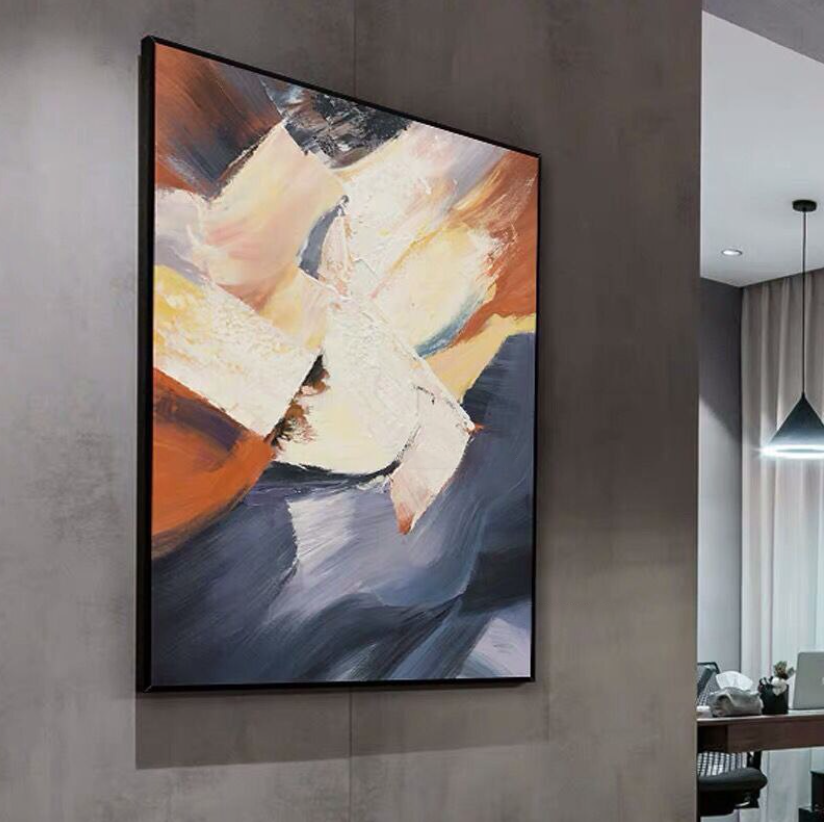 a painting hanging on the wall of a living room