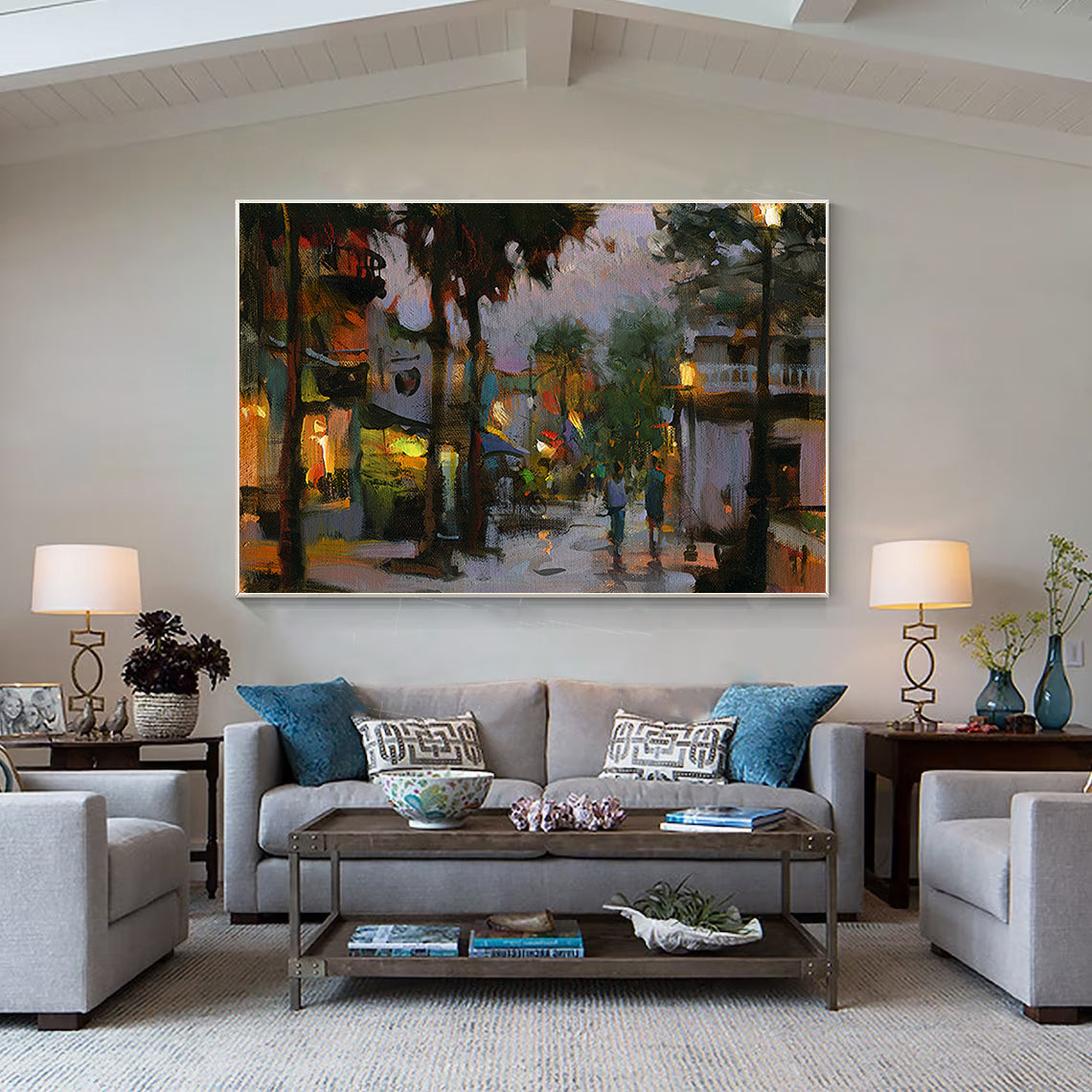 a living room filled with furniture and a painting on the wall