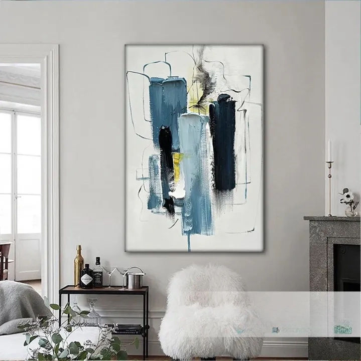 a modern abstract painting hanging on a wall in a living room.