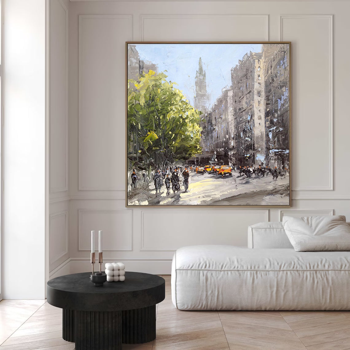 a living room with a couch and a painting on the wall