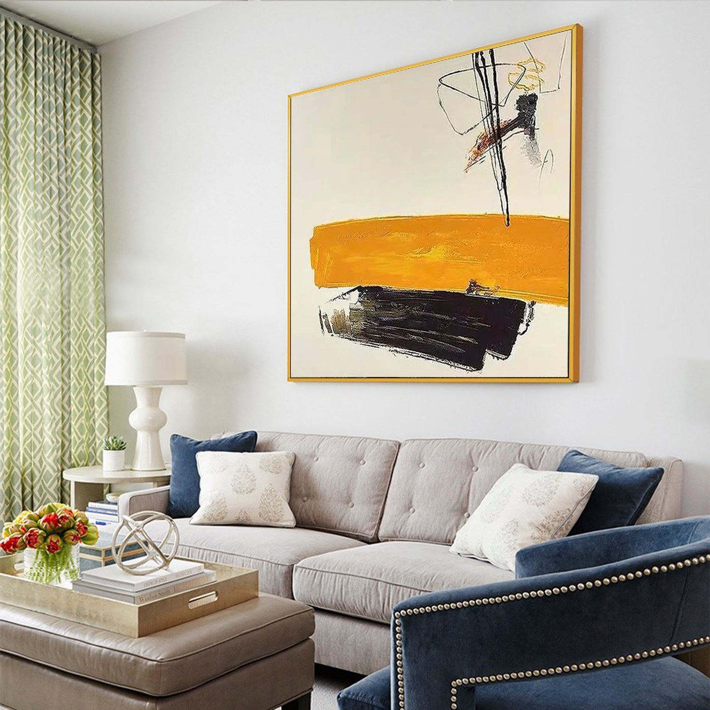 a living room filled with furniture and a painting on the wall