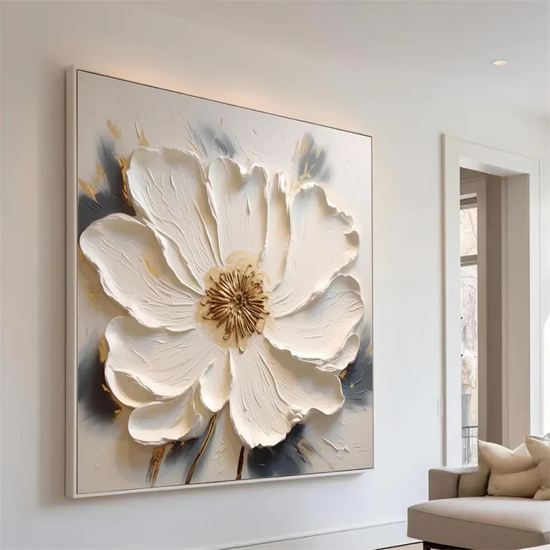 a living room with a couch and a painting on the wall