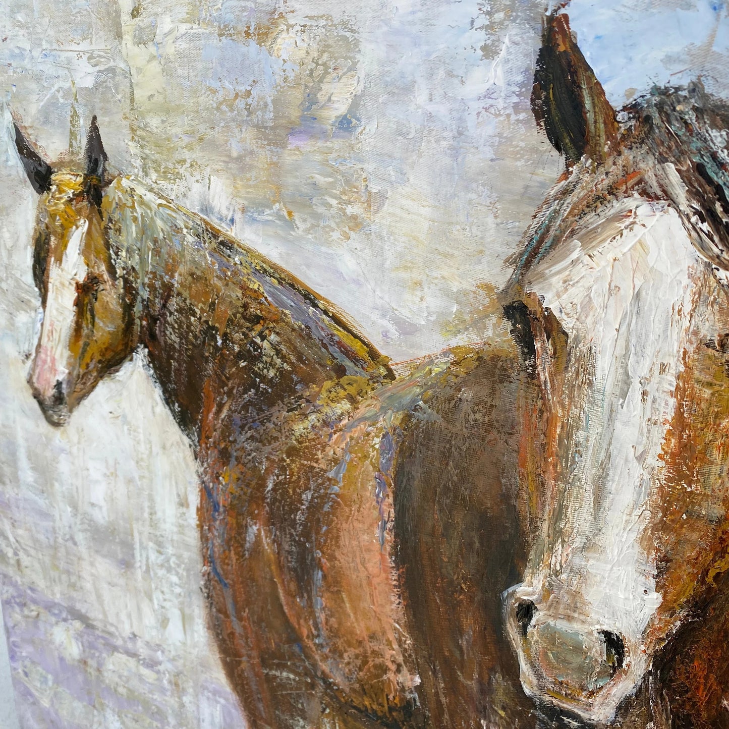 The image is a painting of two horses, one brown and one white, standing close together. The painting has a textured, expressive style with visible brushstrokes and a warm color palette.