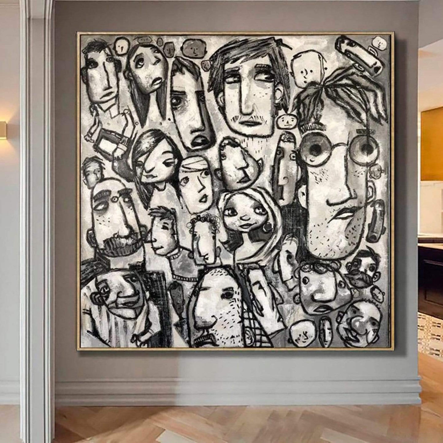 a black and white painting hanging on a wall