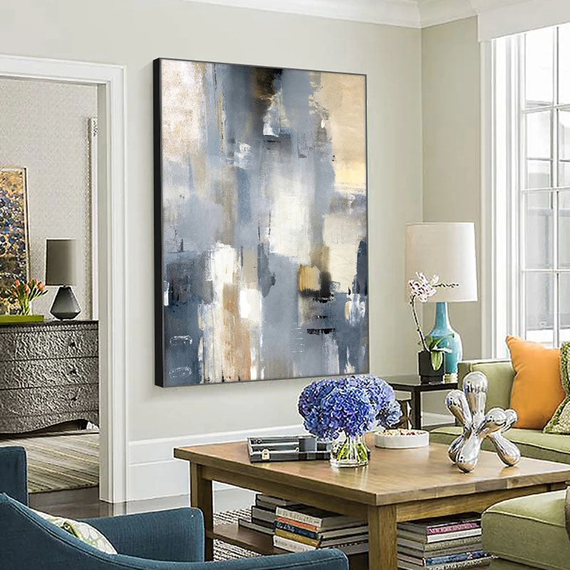 a living room filled with furniture and a painting on the wall