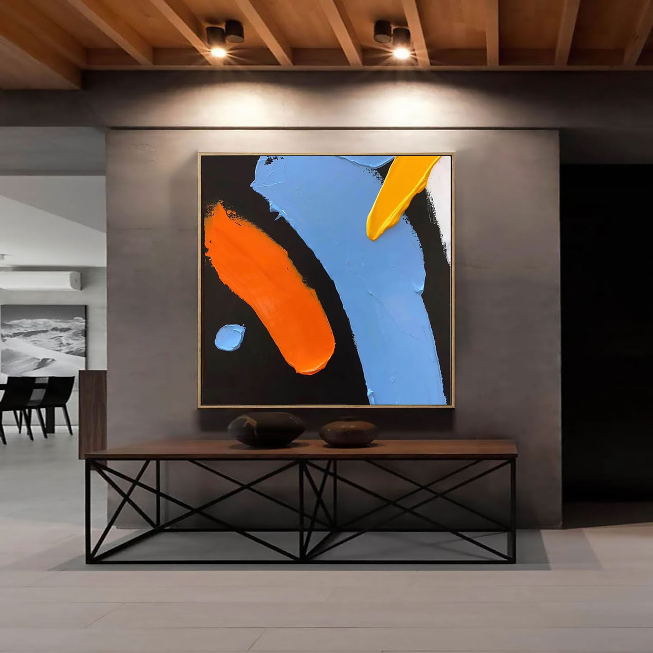 a painting hanging on a wall in a room
