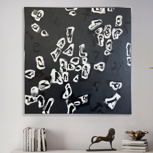 a black and white painting on a white wall