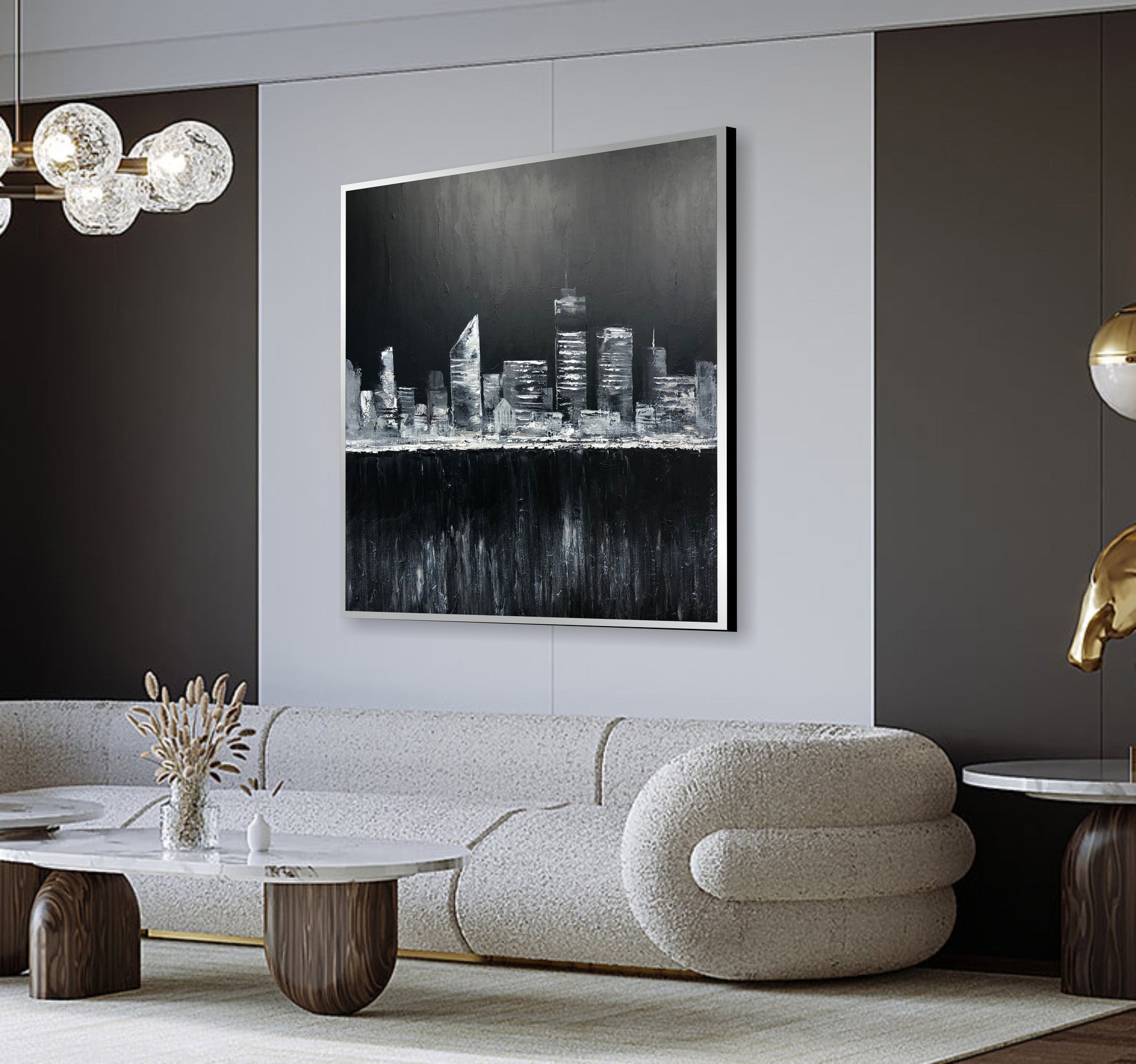 a living room with a white couch and a painting on the wall