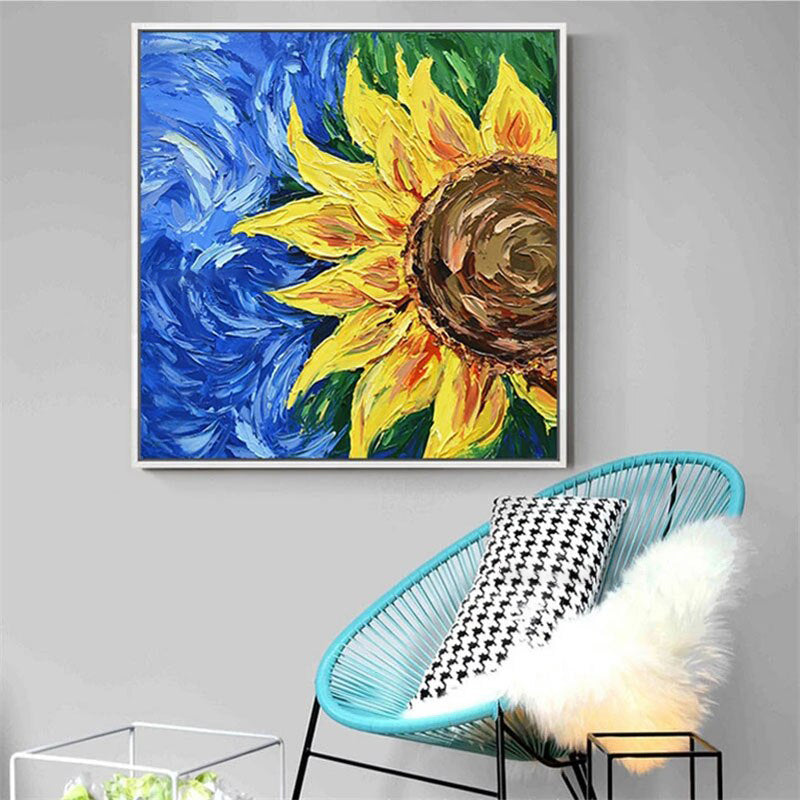 a painting of a sunflower on a gray wall