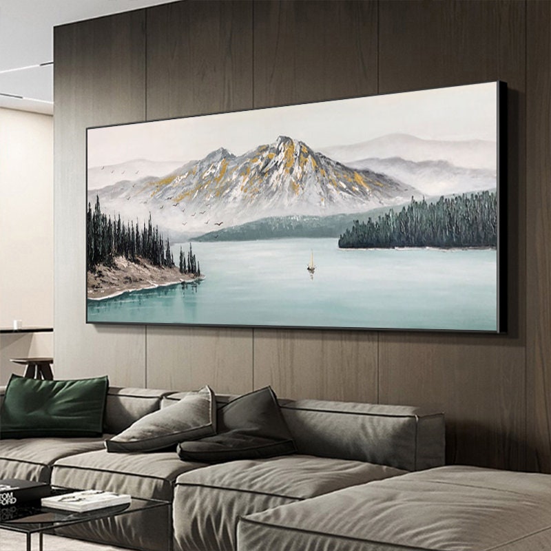 a living room with a large painting on the wall