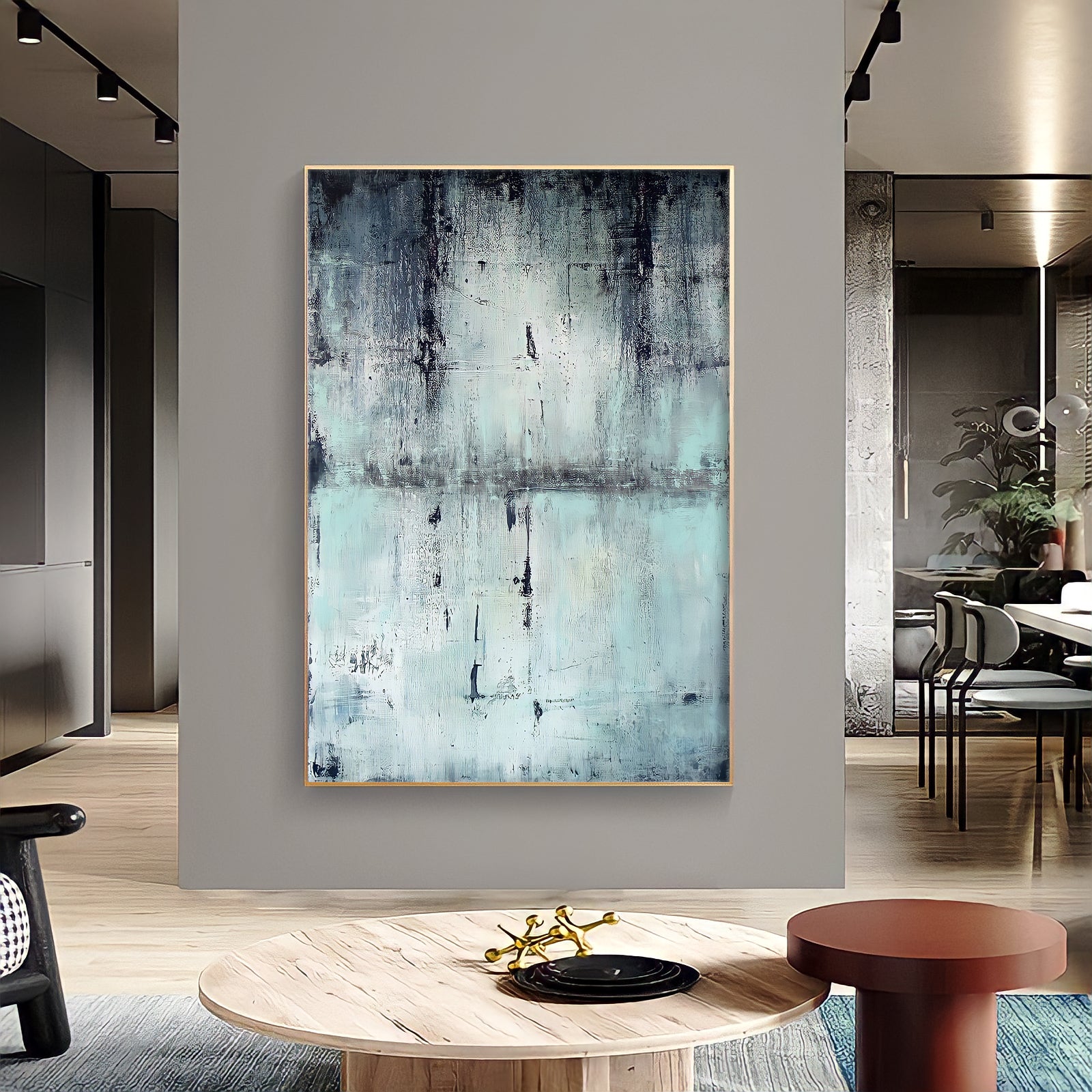 a painting hanging on a wall in a living room