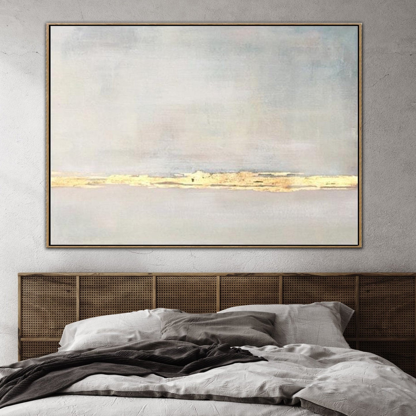 a large, abstract painting hanging on a wall above a bed with a wooden headboard.