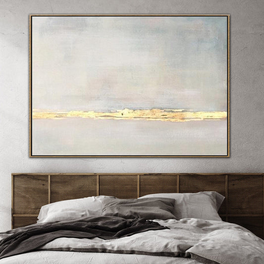a large, abstract painting hanging on a wall above a bed with a wooden headboard.