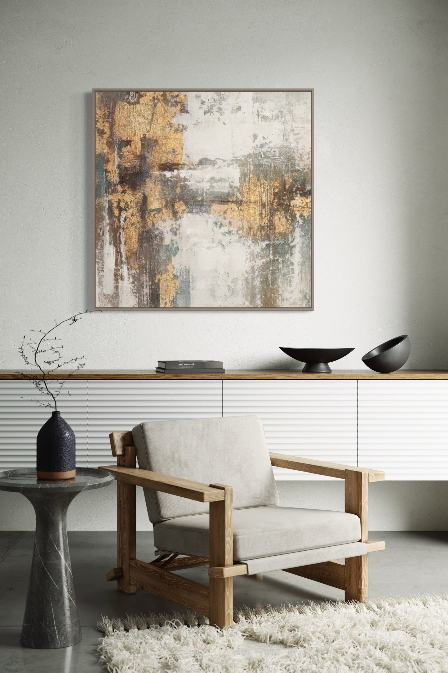 a living room with a white chair and a painting on the wall