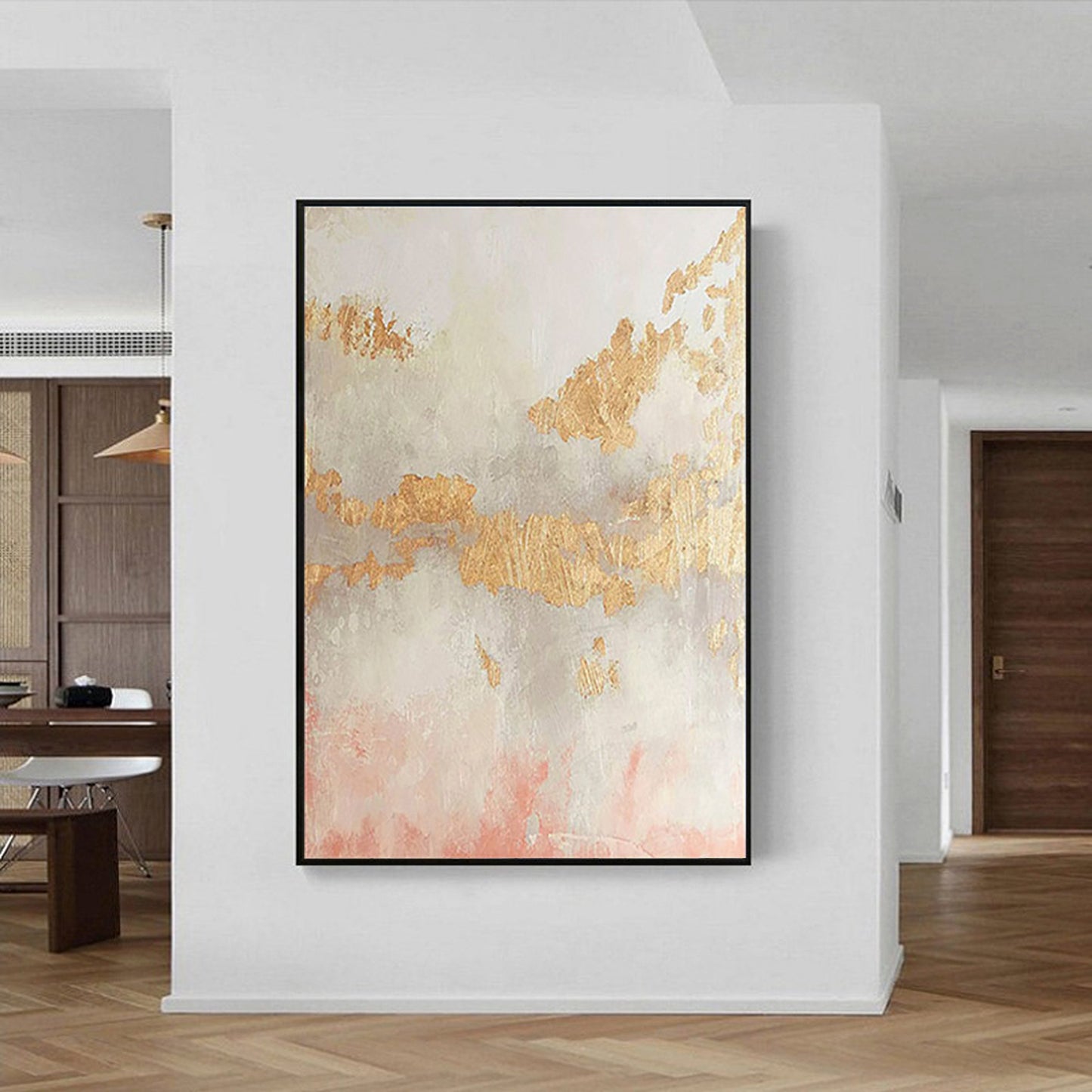 a painting hanging on a wall in a living room