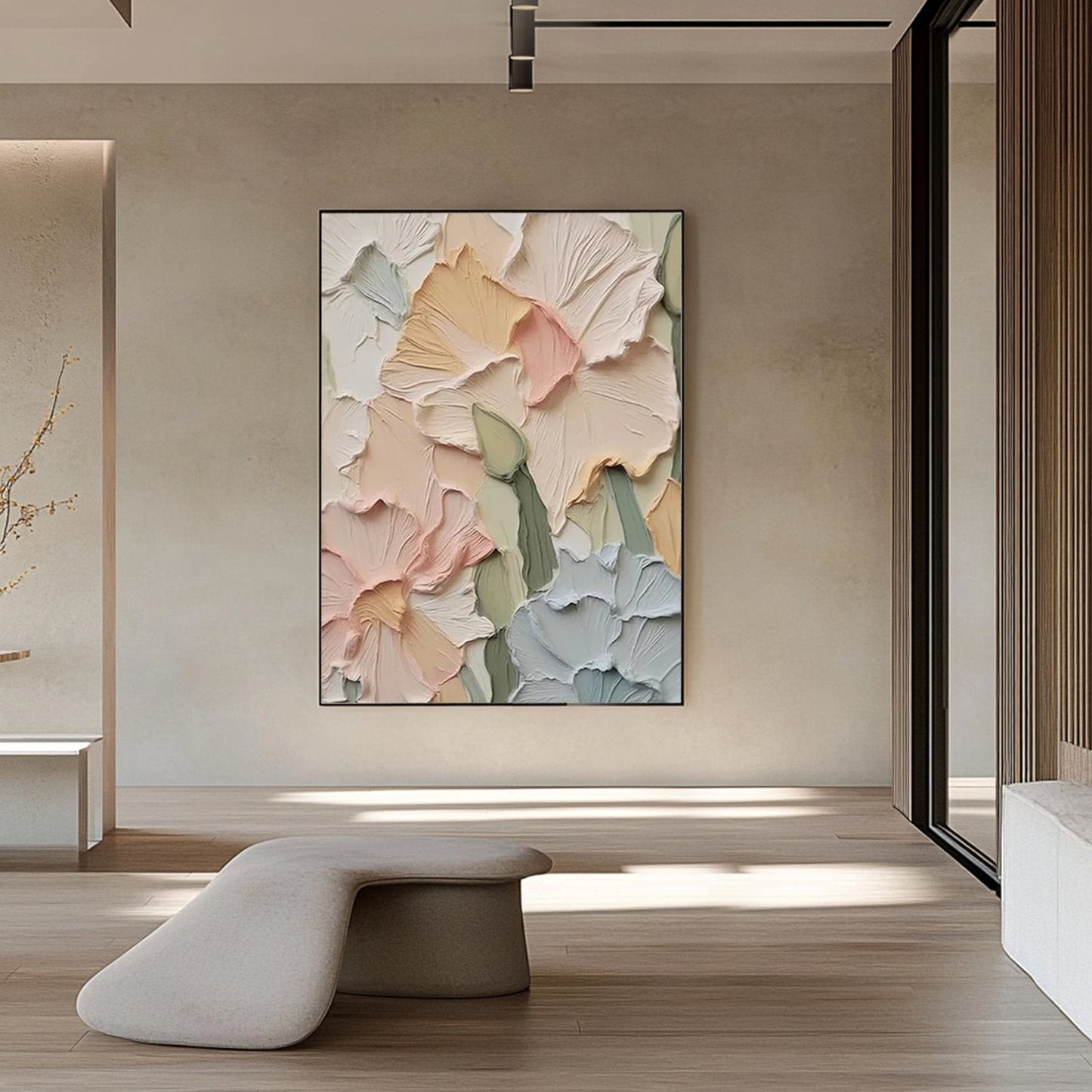a large abstract painting of colorful flowers hanging on a wall in a modern, minimalist room.