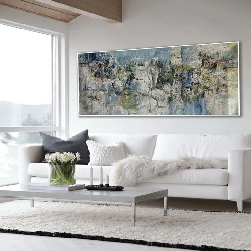 a living room with a large painting on the wall