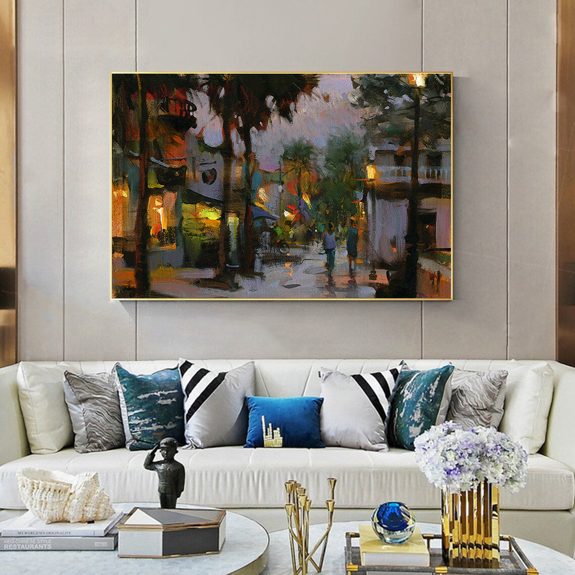 a living room filled with furniture and a painting on the wall