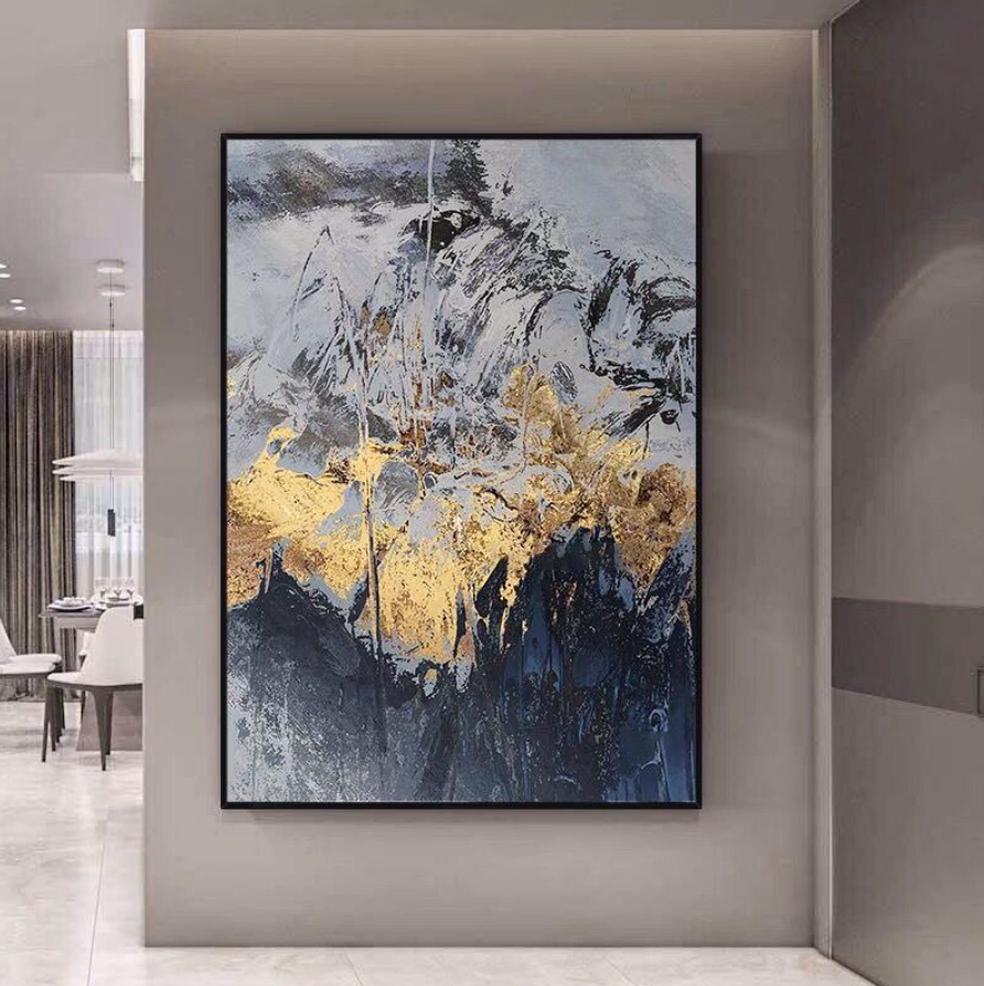 a painting hanging on a wall in a room