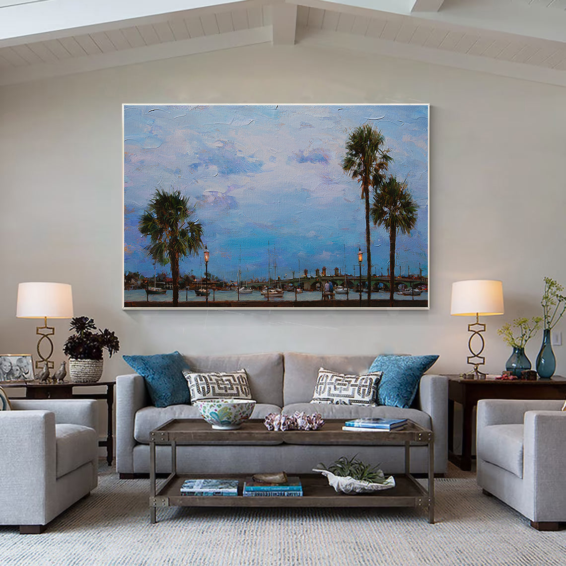 a living room filled with furniture and a painting on the wall