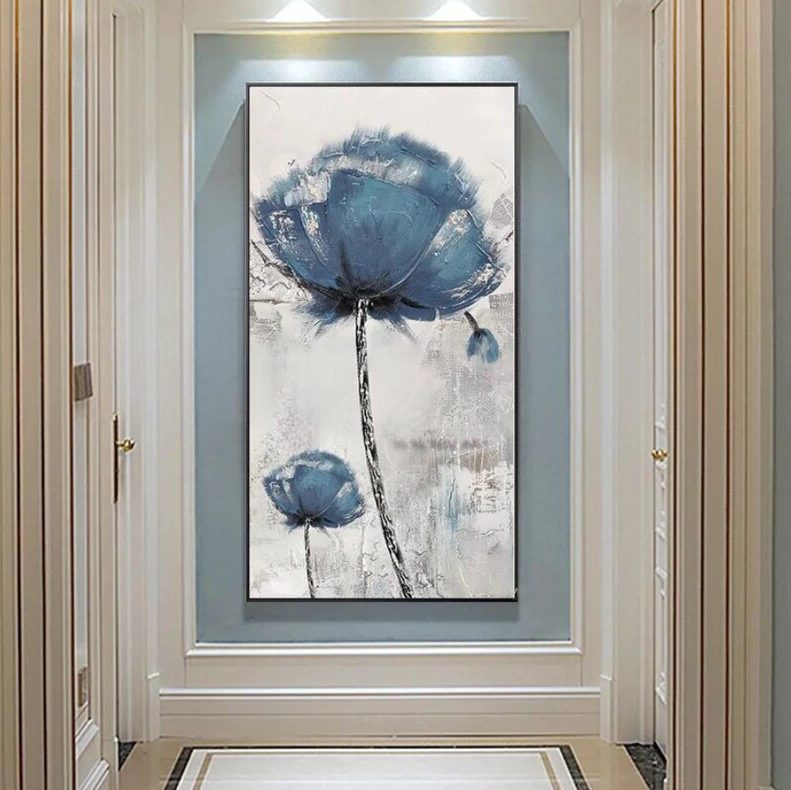 a painting of a blue flower on a white wall