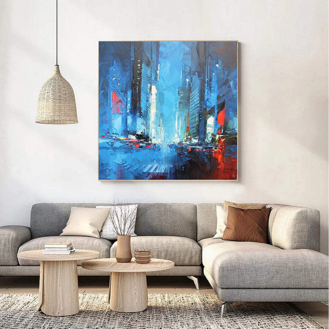 a living room with a large painting on the wall