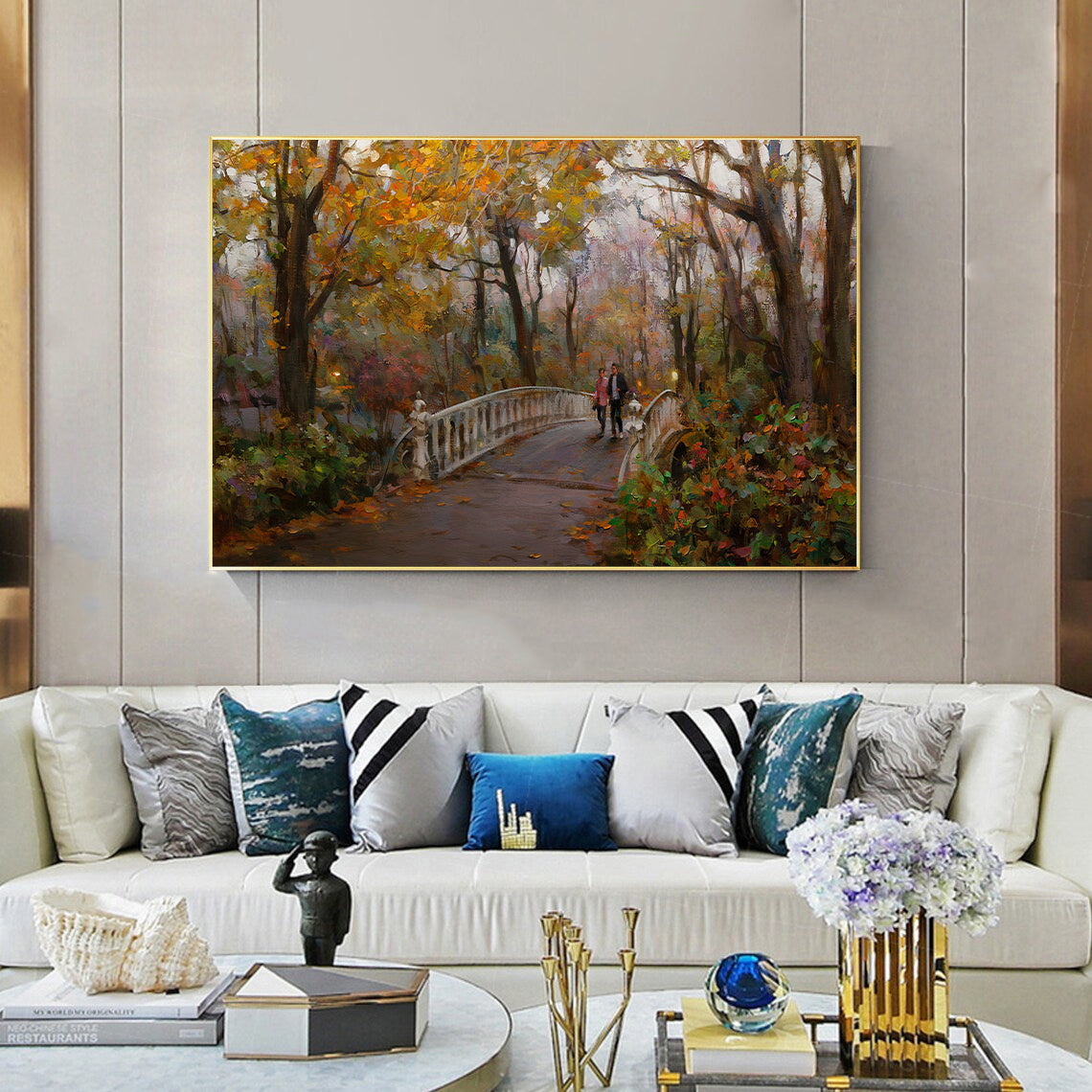 a living room with a white couch and a painting on the wall