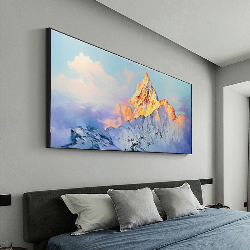 a large painting hanging above a bed in a bedroom