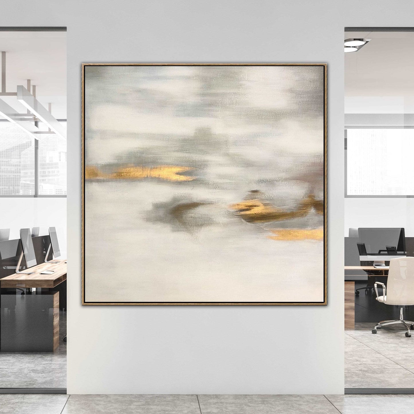 a large abstract painting hanging on a white wall in an office setting.