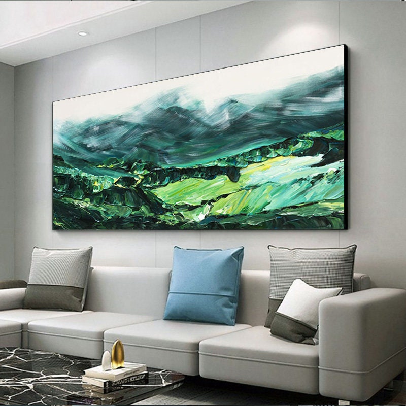 a living room with a large painting on the wall