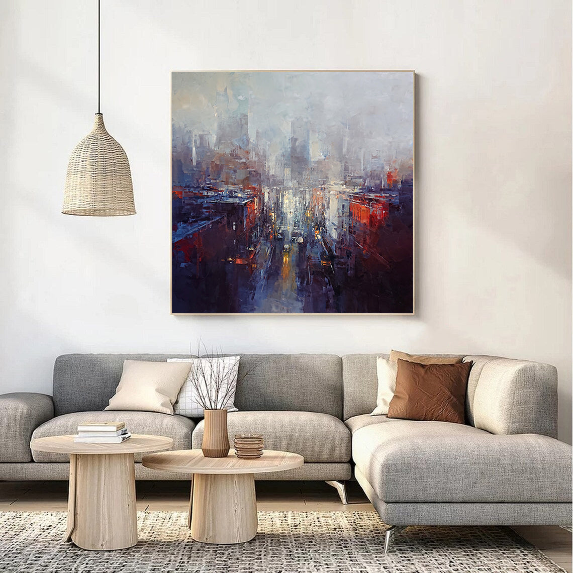 a living room with a large painting on the wall