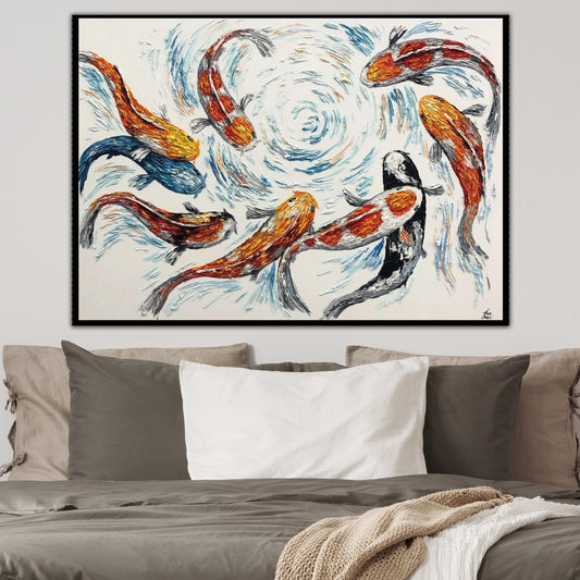 a large painting of colorful fish swimming in a swirling pattern, hanging on a wall above a bed with pillows.
