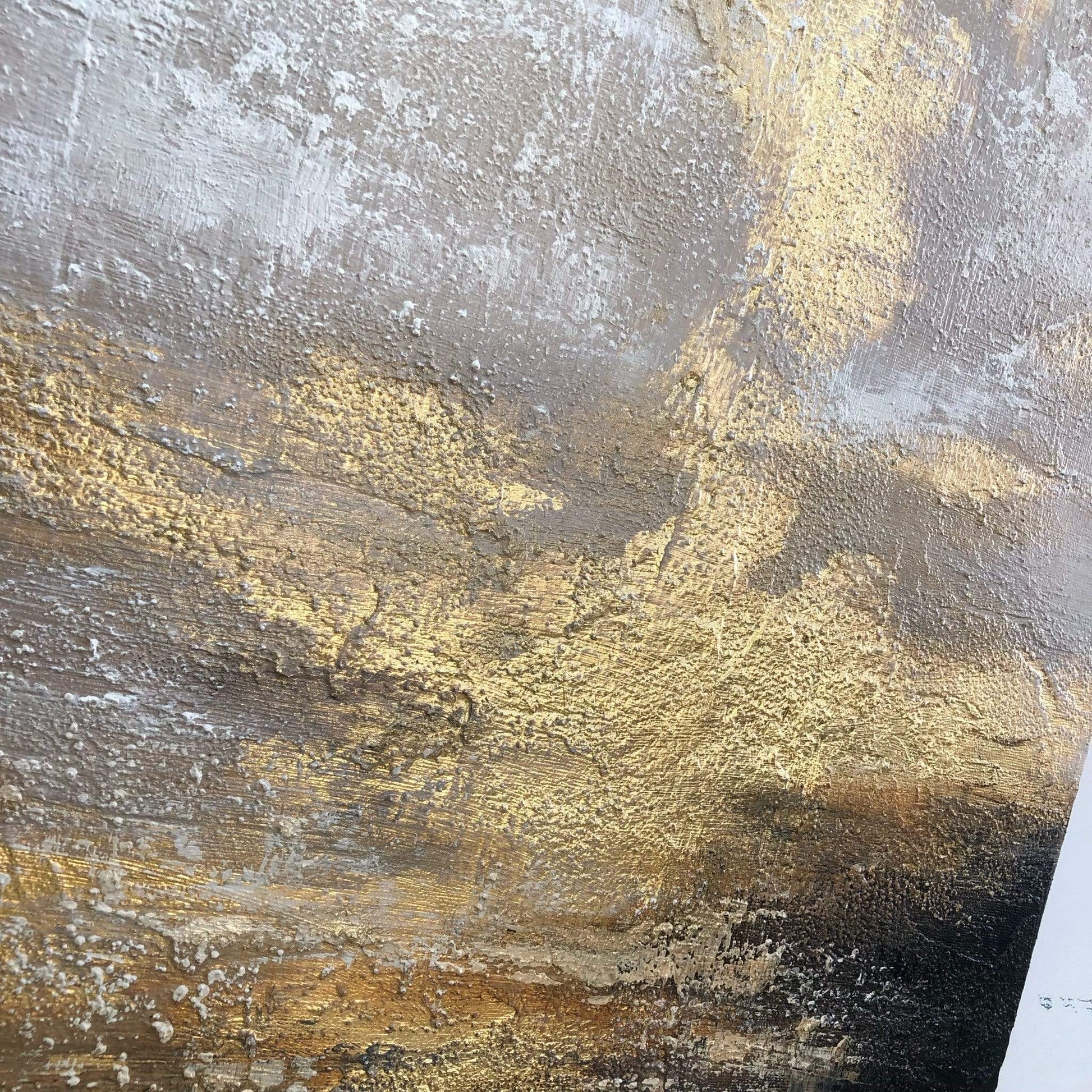 a close up of a wall with gold and black paint