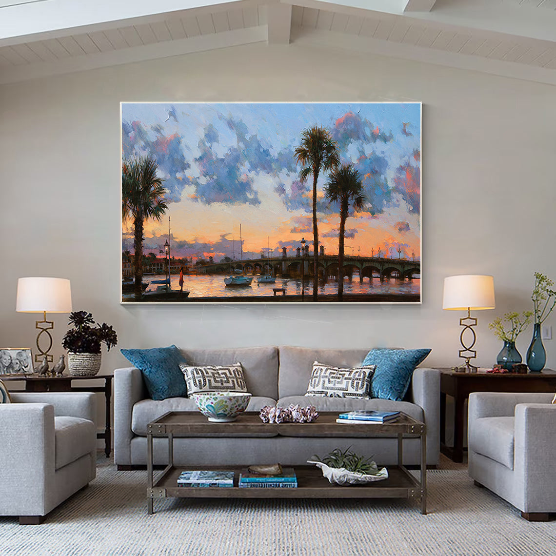 a living room filled with furniture and a painting on the wall