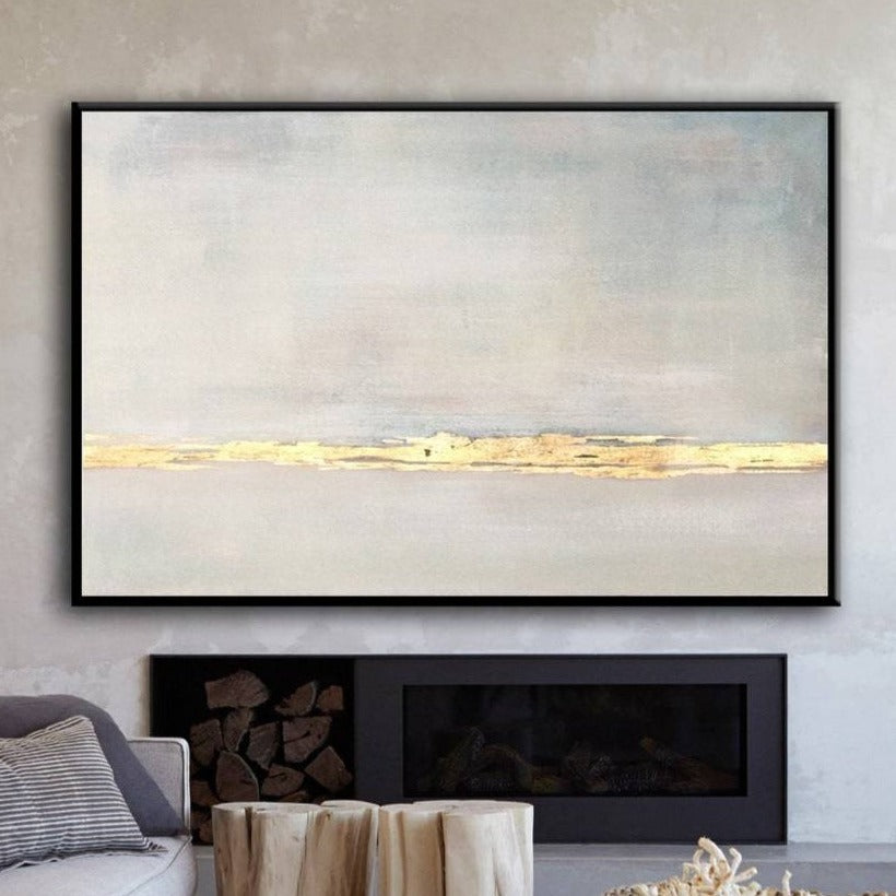 a large abstract painting hanging on a wall above a fireplace in a living room.