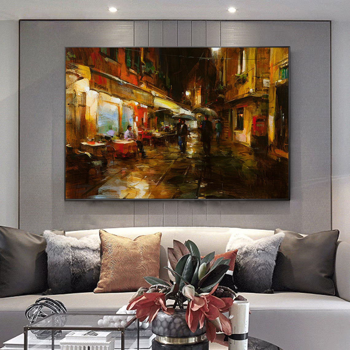 a living room filled with furniture and a painting on the wall