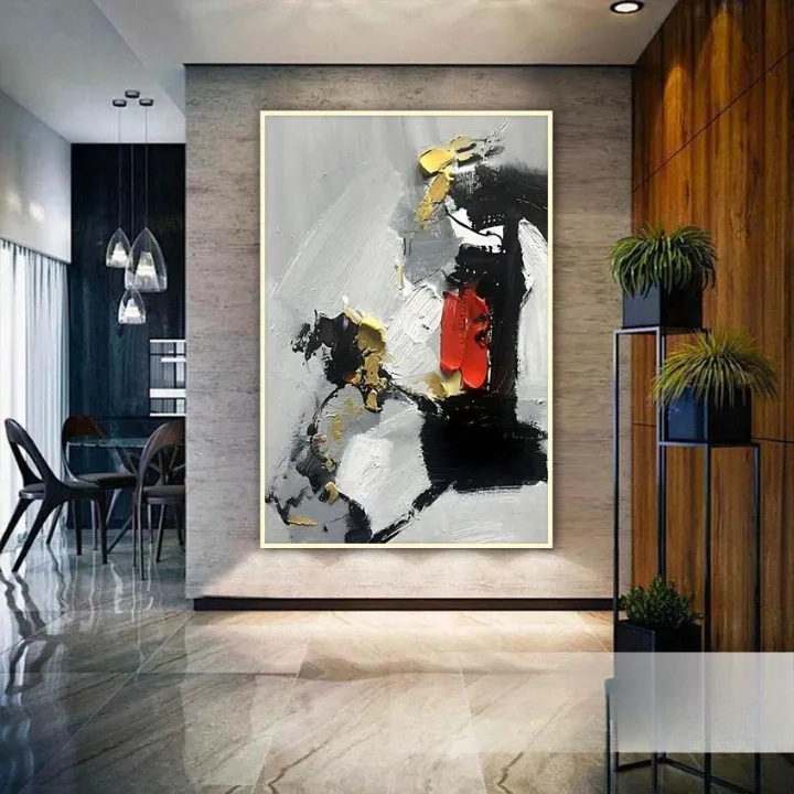 a modern art piece with a large abstract painting on the wall, surrounded by a dining area with chairs and a table.